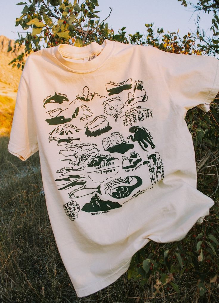 Fisherman-style tee with coastal outfit flatlay – 2025 POD fashion trend