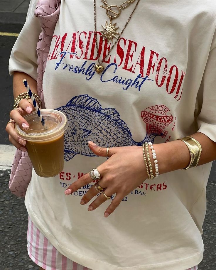 Fisherman-style tee with coastal outfit flatlay – 2025 POD fashion trend