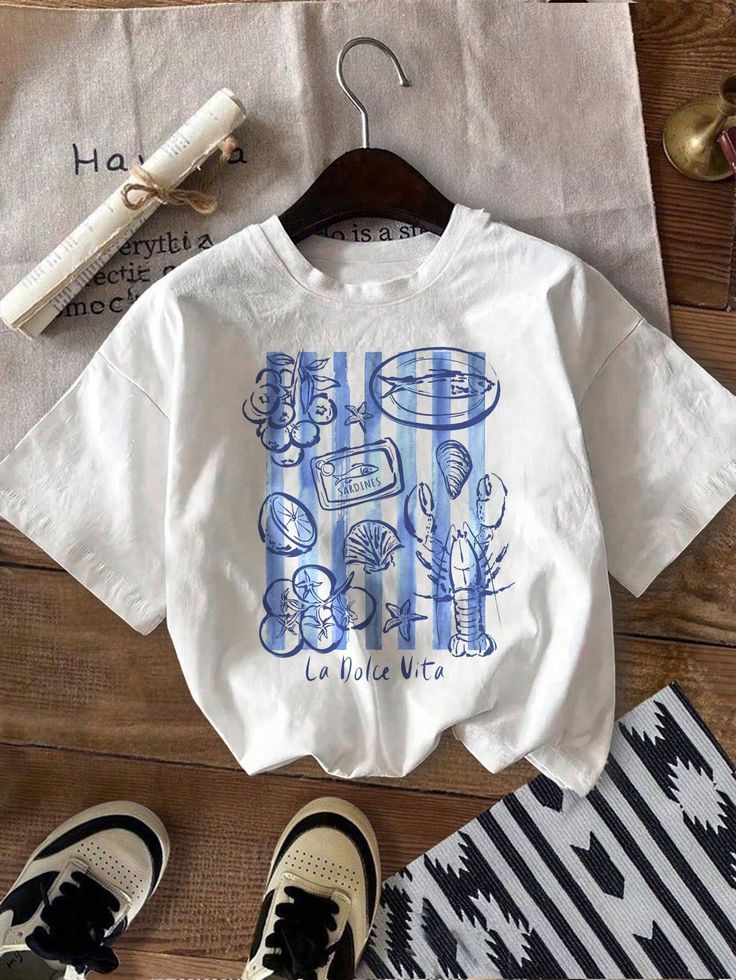 Fisherman-style tee with coastal outfit flatlay – 2025 POD fashion trend